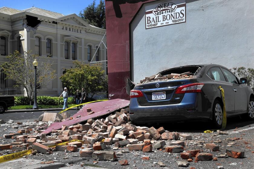 Falling bricks caused damage in downtown Napa in the Aug. 24 quake. Napa was too close to the epicenter to receive a warning, but advancing technology may soon have that capability.