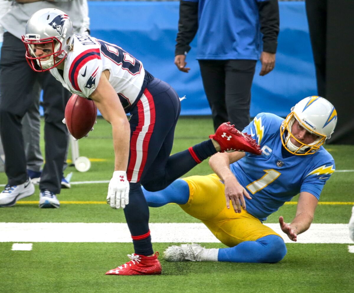 Chargers punter Ty Long fails to tackle New England's Gunner Olszewski.