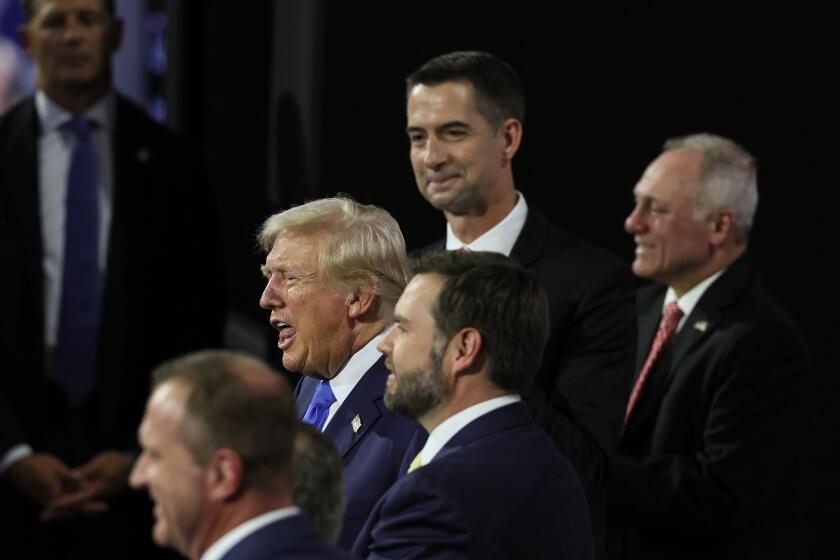 Milwaukee, Wisconsin, Tuesday, July 16, 2024 - Republican Presidential nominee Donald Trump soaks in the stands to watch day two of the Republican National Convention at Fiserv Forum. (Robert Gauthier/Los Angeles Times)