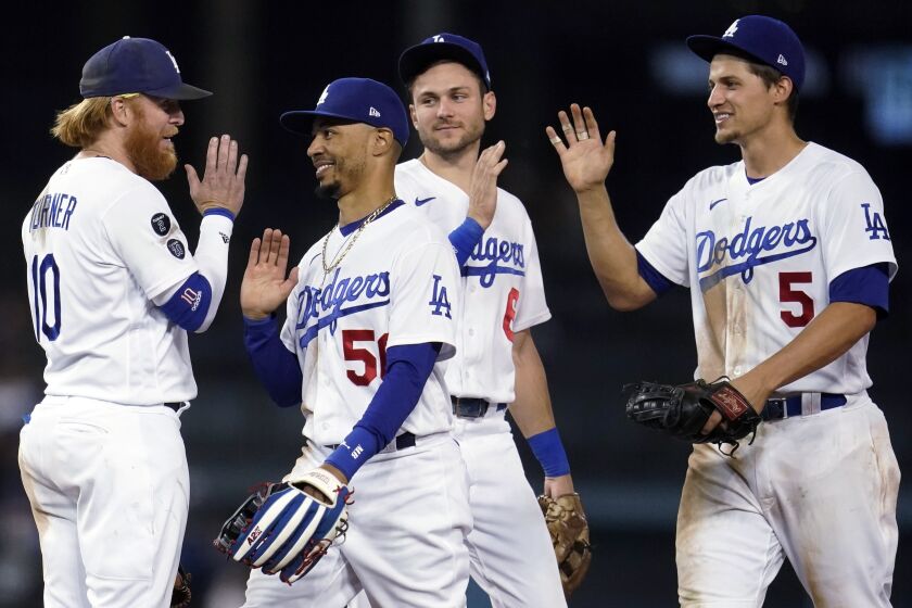 Los Angeles Dodgers' Justin Turner, Mookie Betts, Trea Turner and Corey Seager.