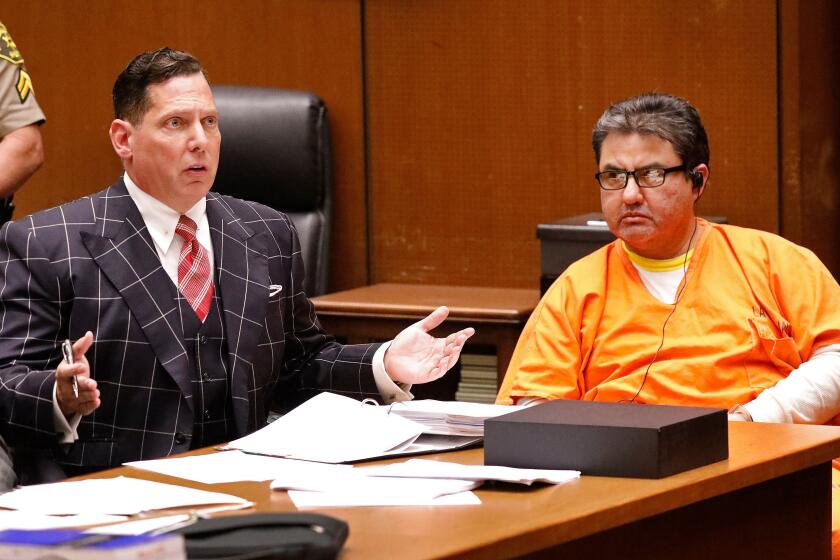 Naason Joaquin Garcia (R), the leader of a Mexico-based La Luz del Mundo evangelical church, along with his defense attorney Ken Rosenfeld (L), attend a bail review hearing at Los Angeles Superior Court on July 15.