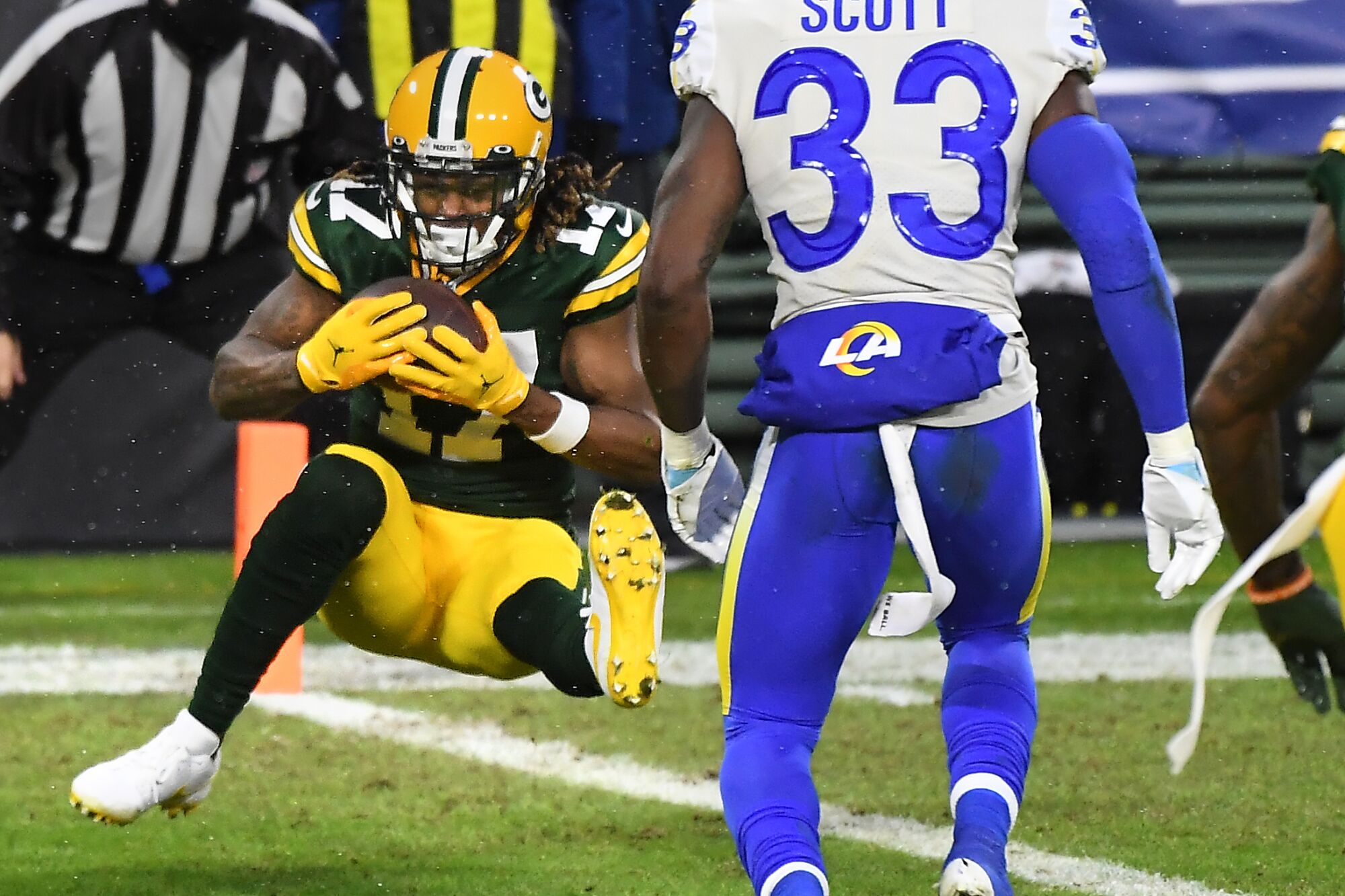 Green Bay Packers wide receiver Davante Adams catches a touchdown pass in front of Rams safety Nick Scott.