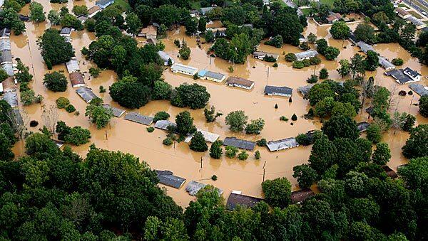 Floodwaters submerge homes in Mableton, Ga., west of Atlanta. Torrential rains soaked the region for days, and at least eight people have died since the onslaught began Sunday.