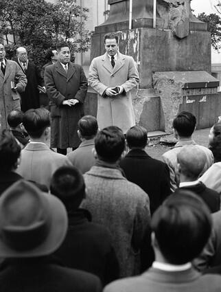 DeShazer holds an outdoor missionary meeting in Tokyo in 1949. After he was released from prison, he returned to the United States to study at Seattle Pacific College, a Christian school. There he met his wife, and the two moved to Japan in 1948 to preach the Gospel.