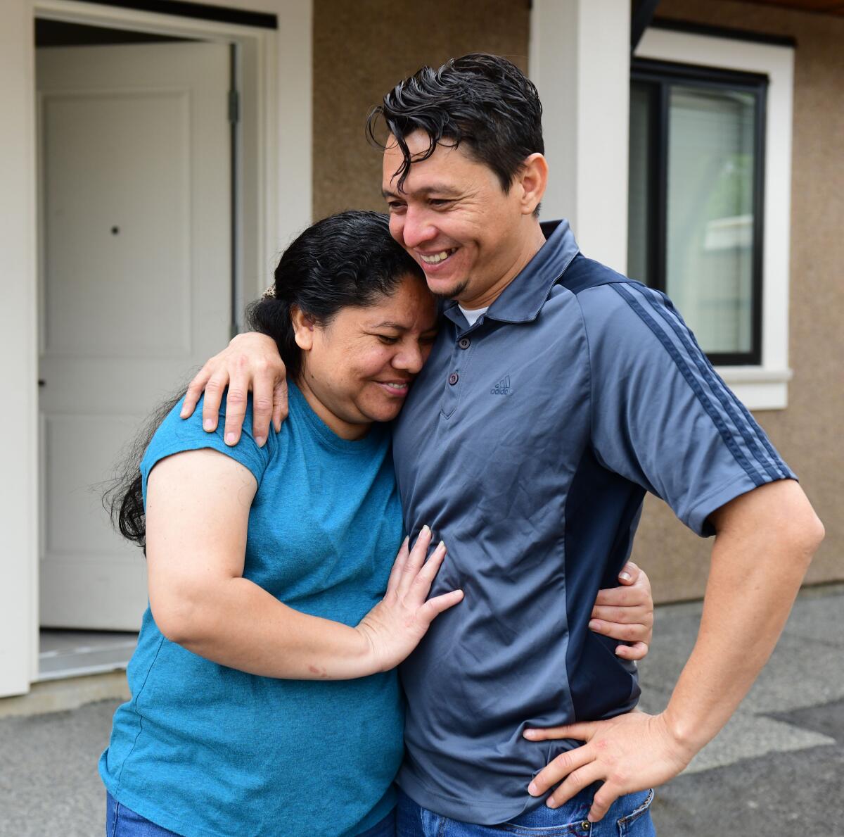 Carlos Rivera and Itzel Alvarez, his fiancee, hug on Thursday.