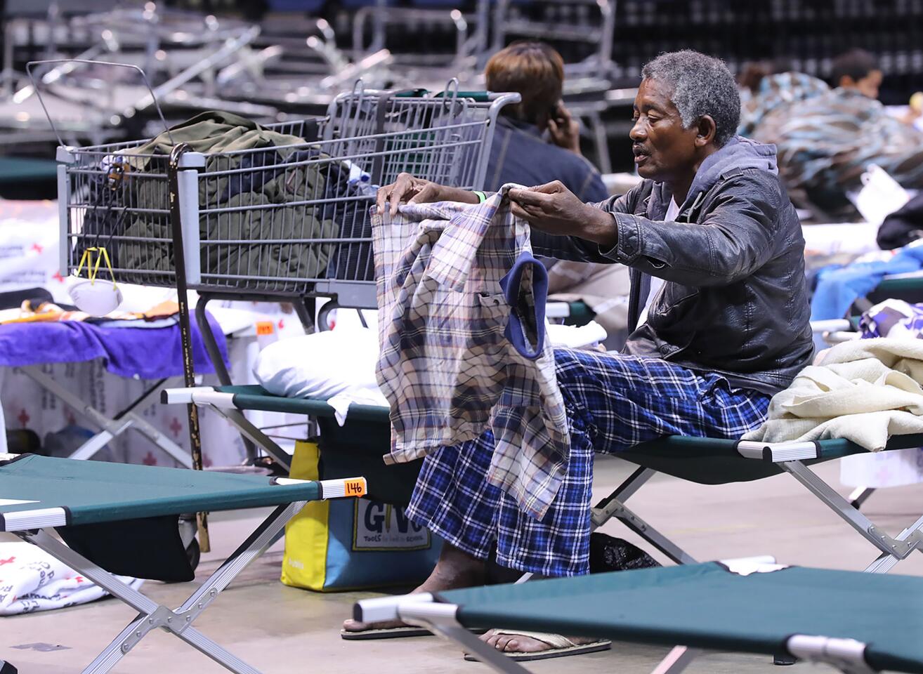 An elderly man drys out his clothes preparing to bed down for the night at the Red Cross shelter in the Albany Civic Center to ride out Hurricane Irma on Sept. 10, 2017, in Albany, Ga.
