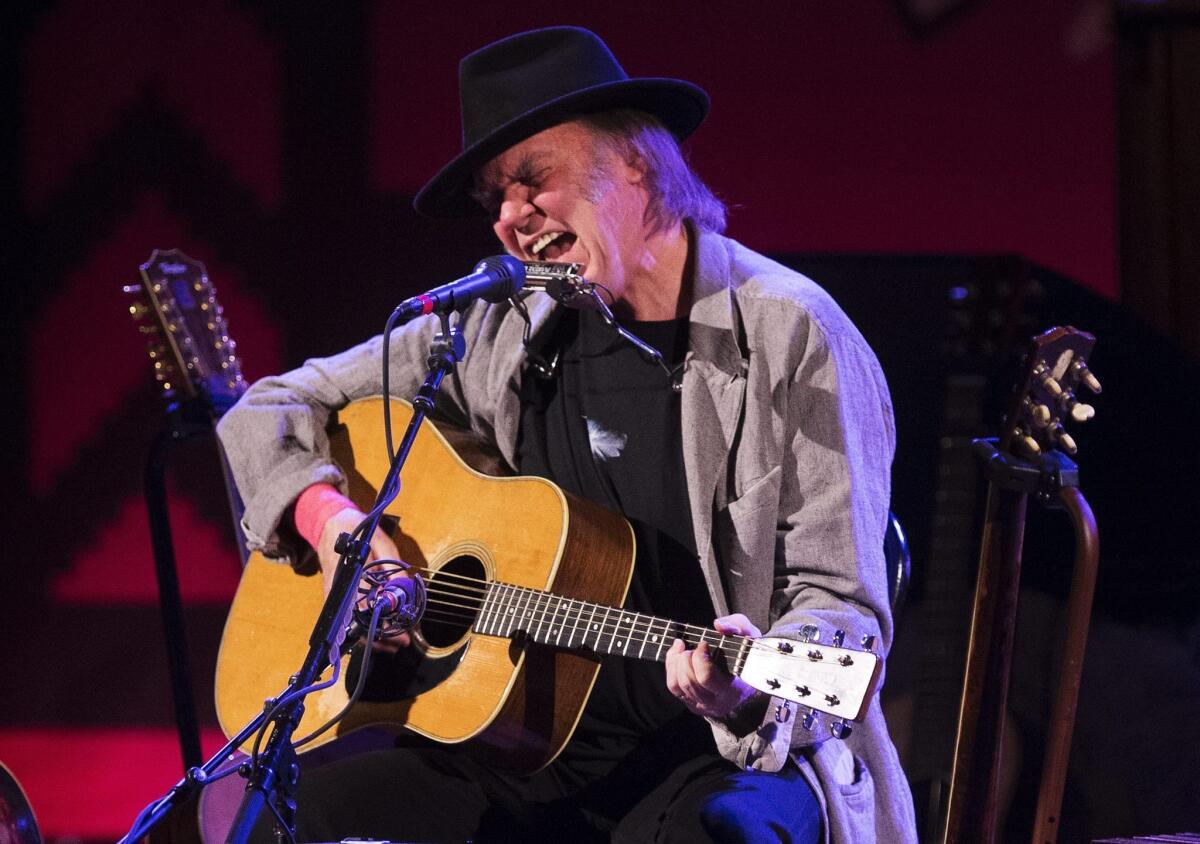 Neil Young performs last month in Toronto. The veteran rocker announced Thursday that he'll play two shows at the Dolby Theatre in Hollywood in March.