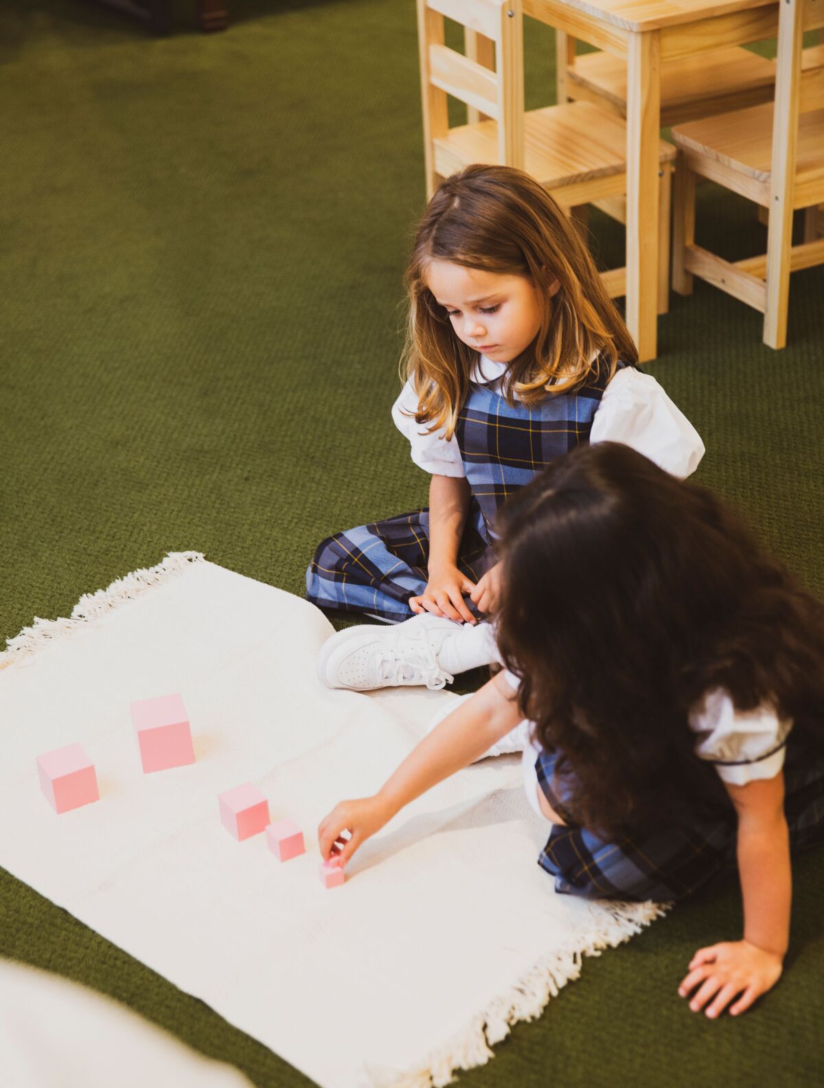 In Montessori schools, children work on the floor rather than at desks.