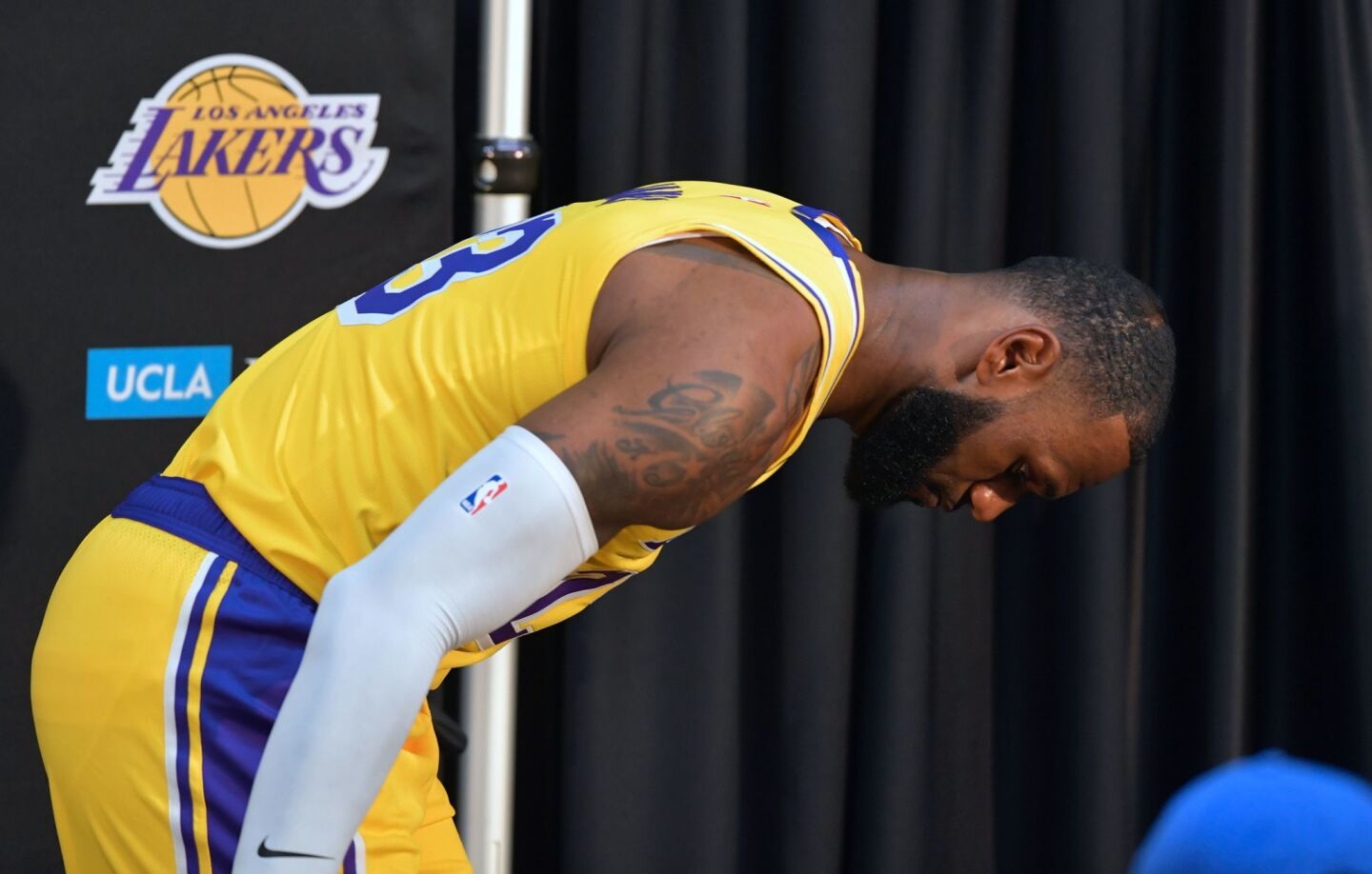 TOPSHOT - LeBron James appears to look for something while stepping out following his press conference on the team's Media Day event in Los Angeles, California, September 24, 2018. - The Lakers open their 2018 NBA season in Portland on October 18th. (Photo by Frederic J. BROWN / AFP)FREDERIC J. BROWN/AFP/Getty Images ** OUTS - ELSENT, FPG, CM - OUTS * NM, PH, VA if sourced by CT, LA or MoD **