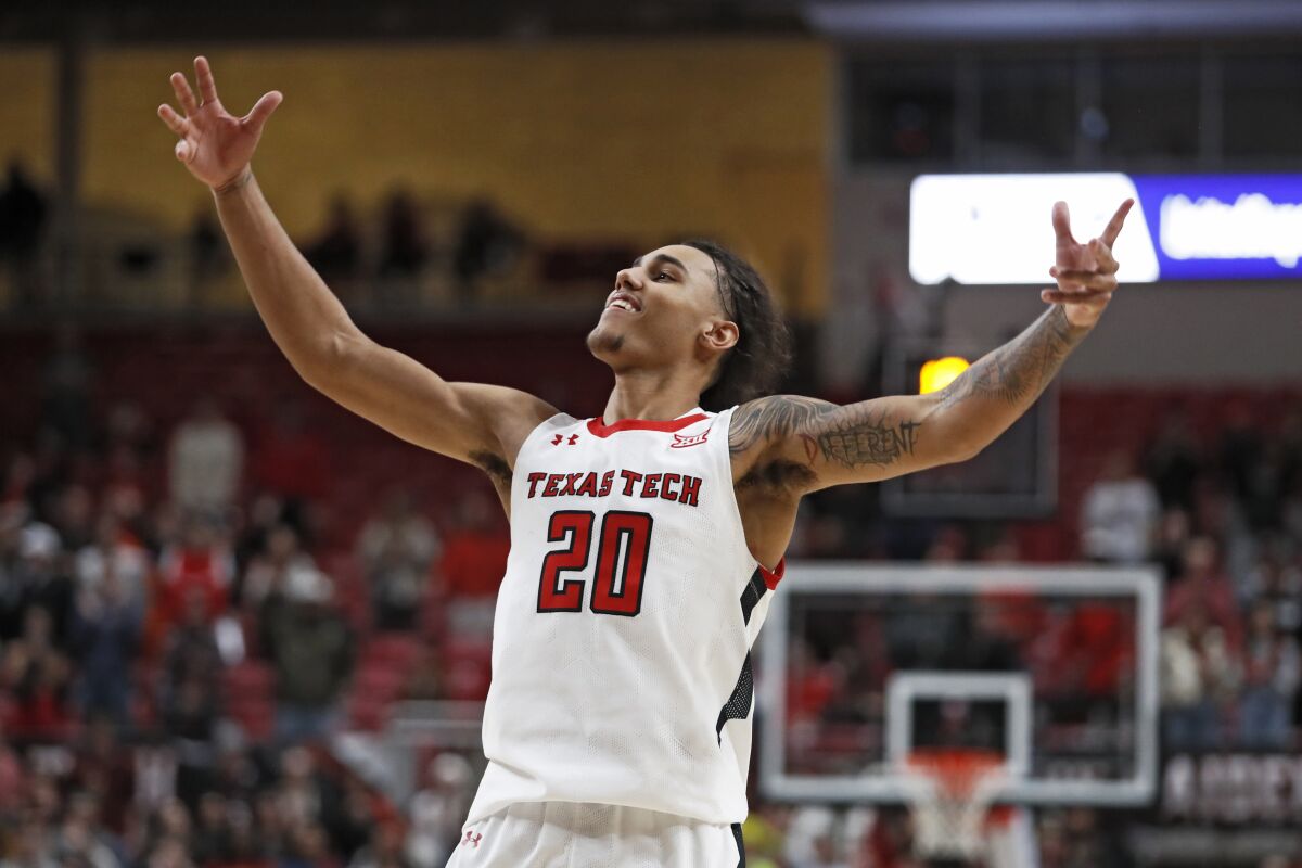 Texas Tech's Jaylon Tyson (20) tries to get the crowd to yell during overtime of an NCAA college basketball game against Iowa State, Monday, Jan. 30, 2023, in Lubbock, Texas. (AP Photo/Brad Tollefson)
