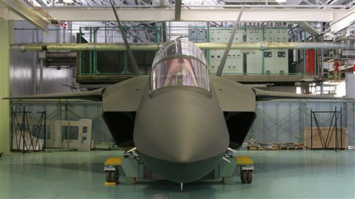 In this 2006 photo released by Japan's Ministry of Defense, an early life-size model of Japan's domestically designed stealth fighter is shown in Japan. A senior military official said Monday, March 7, 2011, Japan is on track to test a domestically designed prototype stealth fighter in three years. (AP Photo/Japan's Ministry of Defense) EDITORIAL USE ONLY, NO SALES