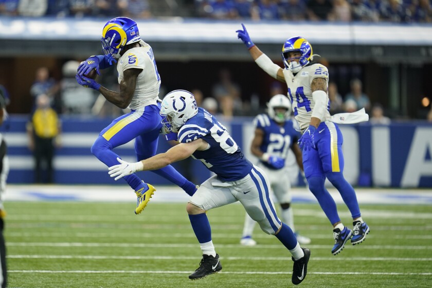 Los Angeles Rams' Jalen Ramsey (5) intercepts a pass intended for Indianapolis Colts' Jack Doyle (84) during the second half of an NFL football game, Sunday, Sept. 19, 2021, in Indianapolis. (AP Photo/Michael Conroy)