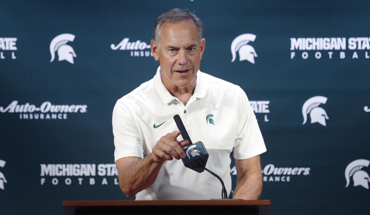 Michigan State football coach Mark Dantonio talks with reporters during the team's media day on Aug. 5.