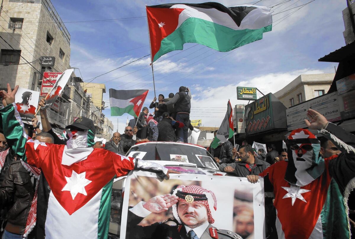 Demonstrators in Amman rally in support of King Abdullah II and his calls for retribution against Islamic State militants.