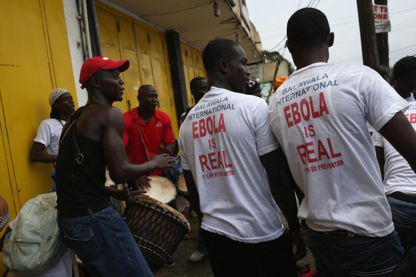 Public health advocates in Monrovia, Liberia, stage street performances at an ebola awareness and prevention event on Monday.