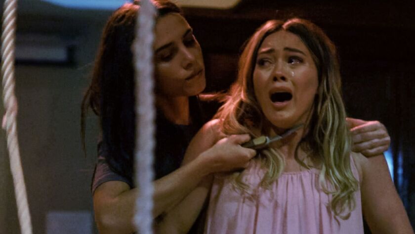 Bella Popa, left, as Sadie and Hilary Duff as Sharon Tate in the Saban Films thriller "The Haunting of Sharon Tate."