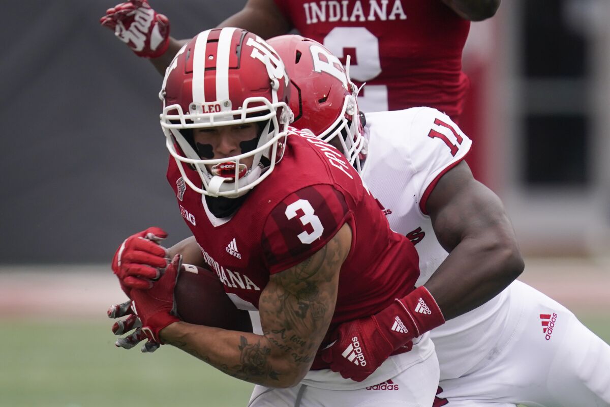 Indiana wide receiver Ty Fryfogle (3) is tackled by Rutgers linebacker Drew Singleton (11) during the first half of an NCAA college football game, Saturday, Nov. 13, 2021, in Bloomington, Ind. (AP Photo/Darron Cummings)