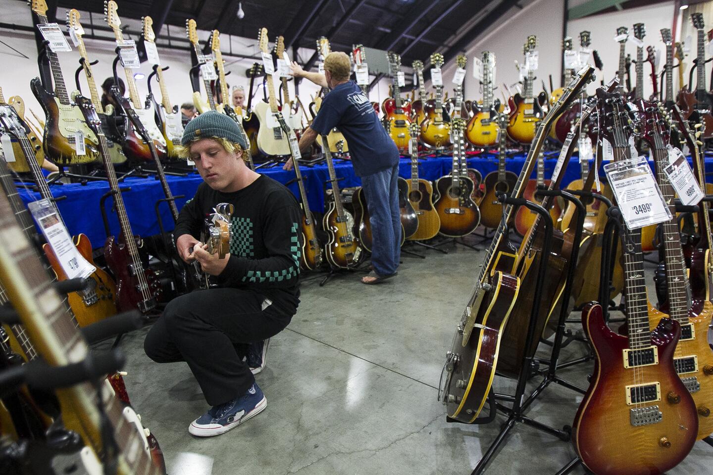 Lauren Rothman plays a 1966 Fender jazz base during the 2015 SoCal World Guitar Show at the OC Fair & Event Center on Saturday, August 22. (Scott Smeltzer - Daily Pilot)