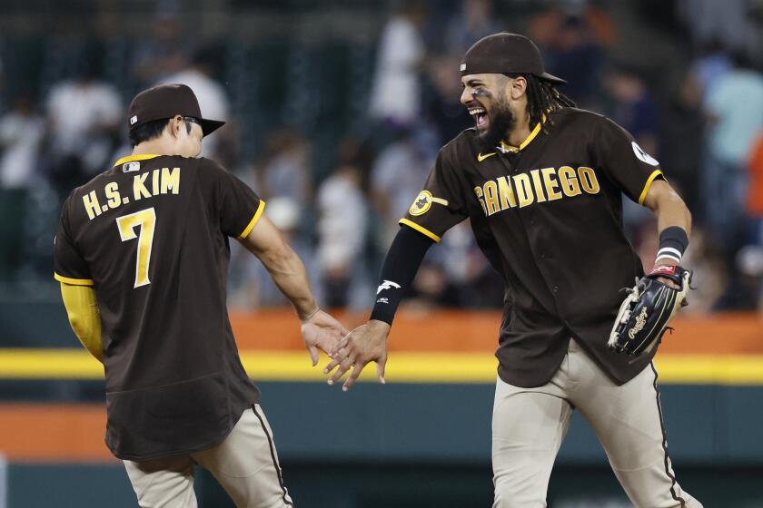 DETROIT, MI - JULY 22: Ha-Seong Kim #7 of the San Diego Padres celebrates with Fernando Tatis Jr. #23 after a 14-3 win over the Detroit Tigers at Comerica Park on July 22, 2023 in Detroit, Michigan. (Photo by Duane Burleson/Getty Images)
