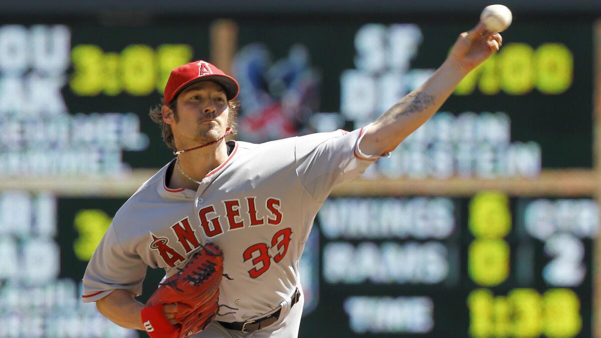 Angels starter C.J. Wilson delivers a pitch during the first inning of a 14-4 win over the Minnesota Twins on Sept. 7.