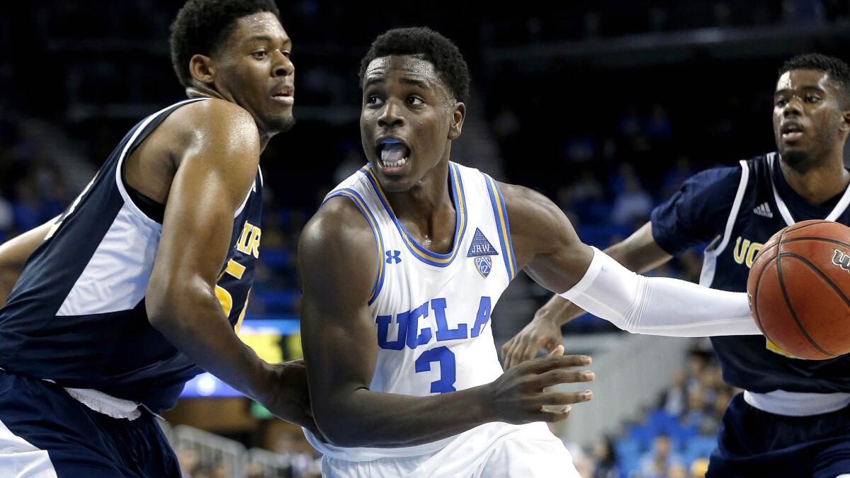 Bruins guard Aaron Holiday (3) drives against UC Irvine forward Elston Jones during the first half Sunday.