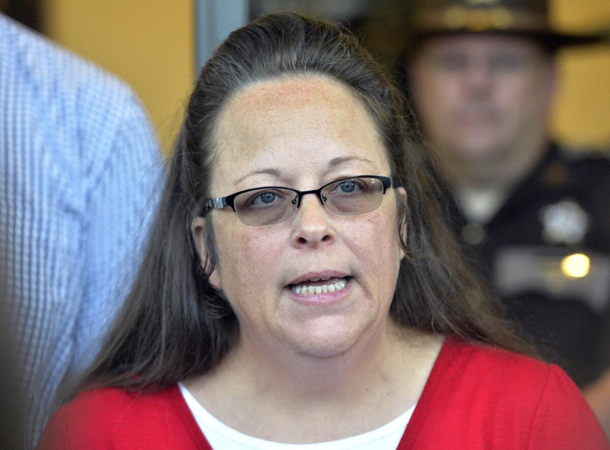 Rowan County Clerk Kim Davis talks with the media outside the courthouse.