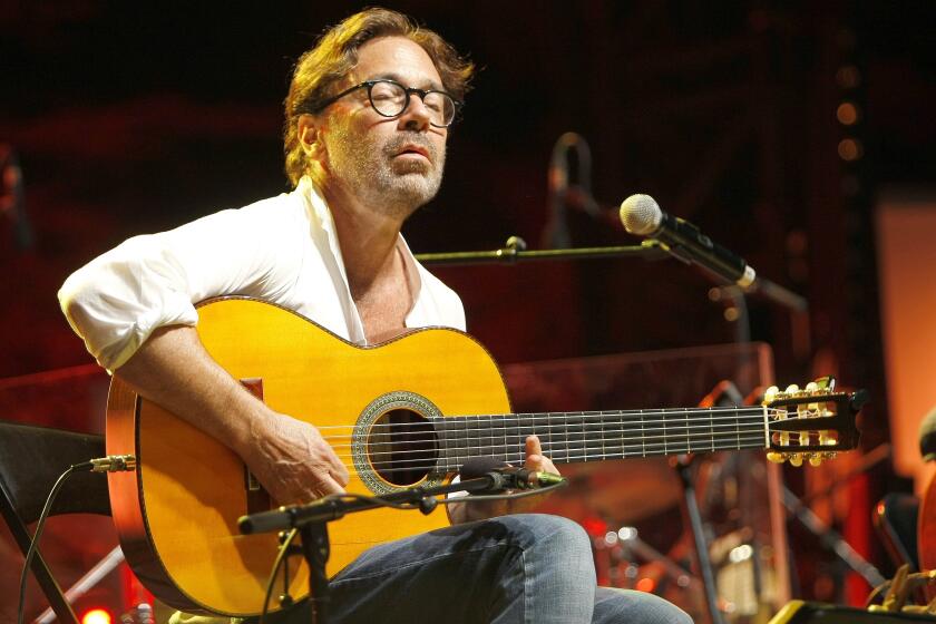 American guitarist Al Di Meola performs at the Five Continents Jazz Festival, in Marseille, southern France, Thursday, July 24, 2014. The award-winning U.S. guitarist Al Di Meola suffered a heart attack in Romania’s capital but is currently in a stable condition and receiving treatment, a hospital spokesperson said on Thursday Sept. 28, 2023. (AP Photo/Claude Paris)