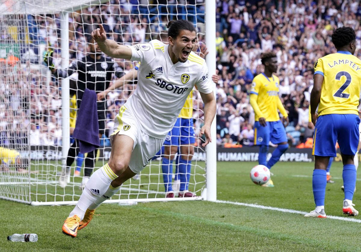 Leeds United's Pascal Struijk celebrates scoring their side's first goal of the game during the English Premier League soccer match between Leeds United and Brighton and Hove, at Elland Road, Leeds, England, Sunday May 15, 2022. (Danny Lawson/PA via AP)