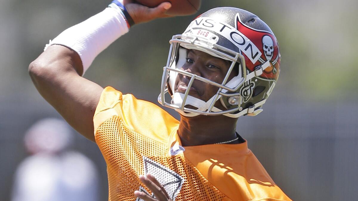 Tampa Bay Buccaneers quarterback Jameis Winston throws a pass during rookie minicamp on Friday.