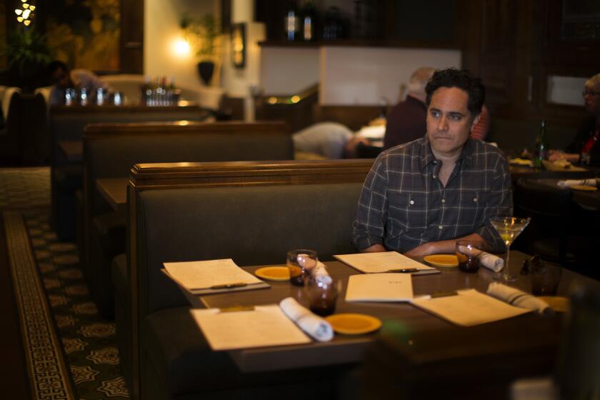 Rajiv Joseph relaxes with a martini as he awaits friends at Kendall's ahead of the opening night of a preview performance for his new play, "Archduke," on April 25 in Los Angeles.