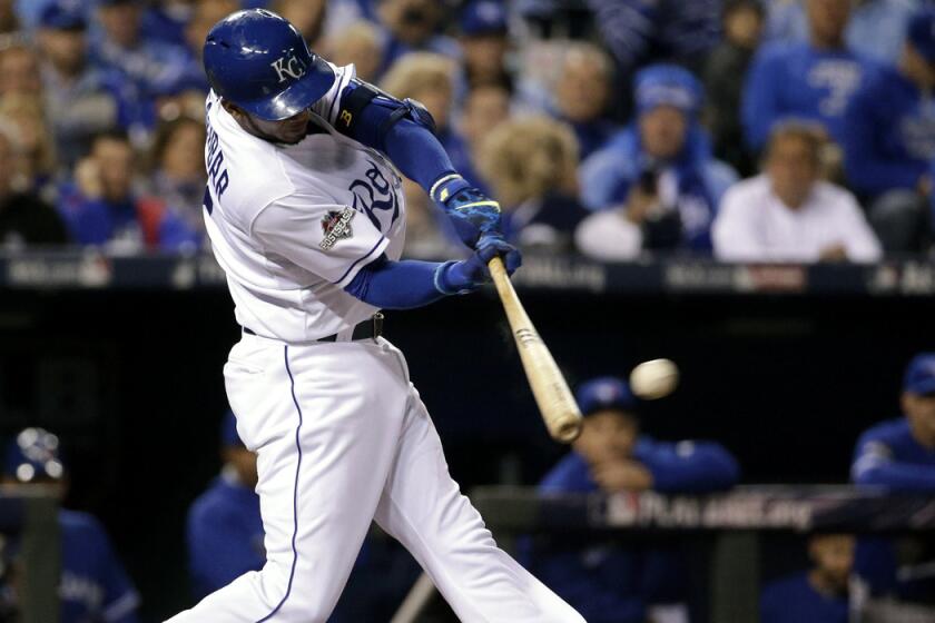 Kansas City Royals' Alcides Escobar hits a double against the Toronto Blue Jays during Game 1 of the American League Championship Series on Friday.
