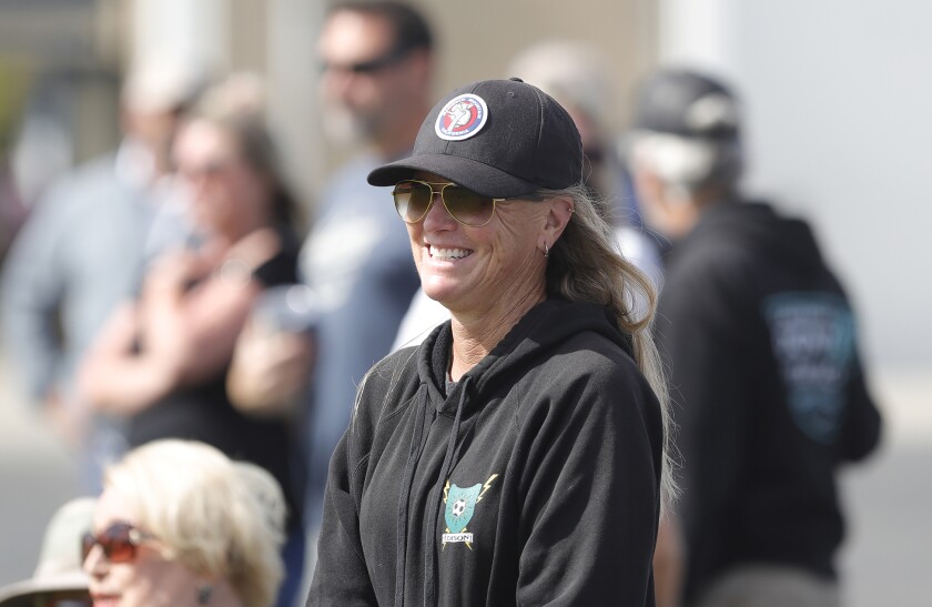 Kerry Crooks is all smiles after he daughter ran for a touchdown against Calvary Chapel .