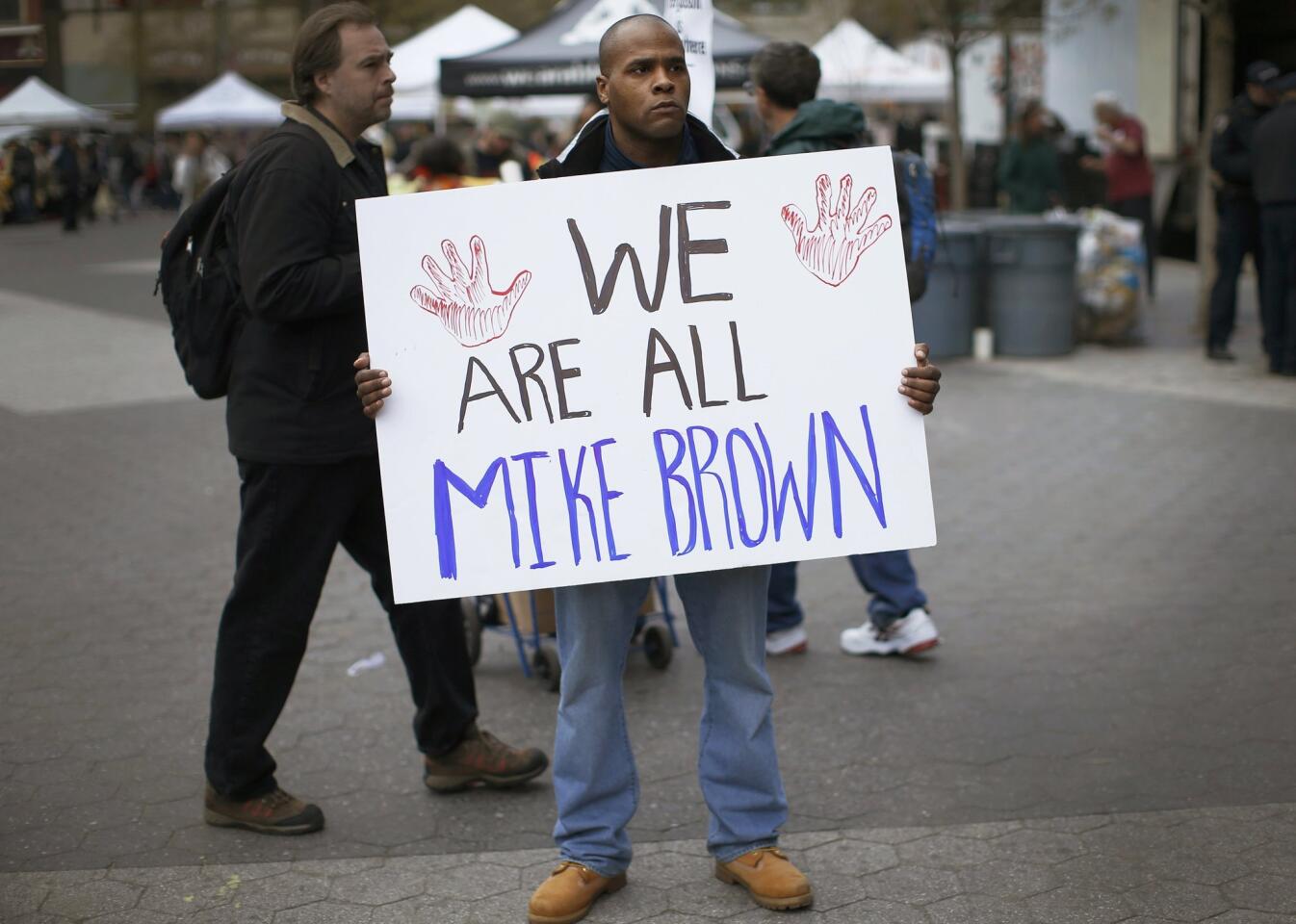 A man protests the August shooting death of Michael Brown in Ferguson, Mo., during a Dec. 1 rally at Union Square in New York City.
