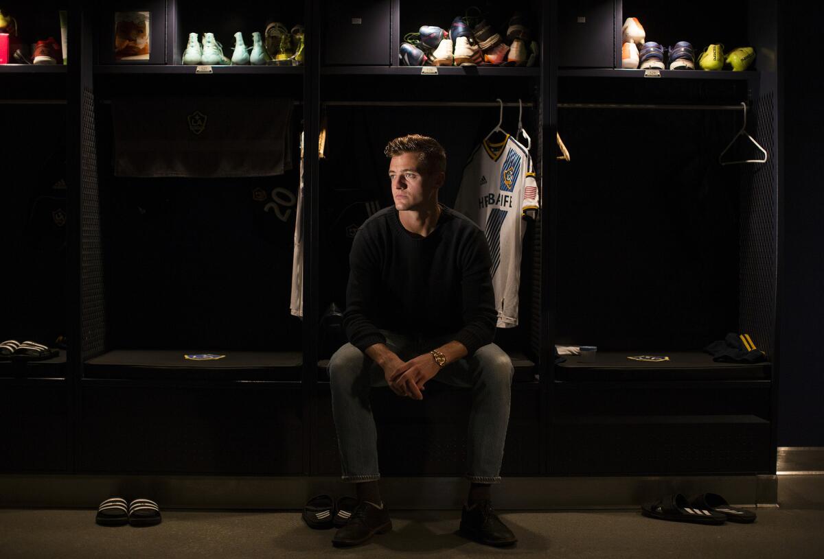 Los Angeles Galaxy soccer player Robbie Rogers in front of his locker at StubHub Center in Carson, Calif.