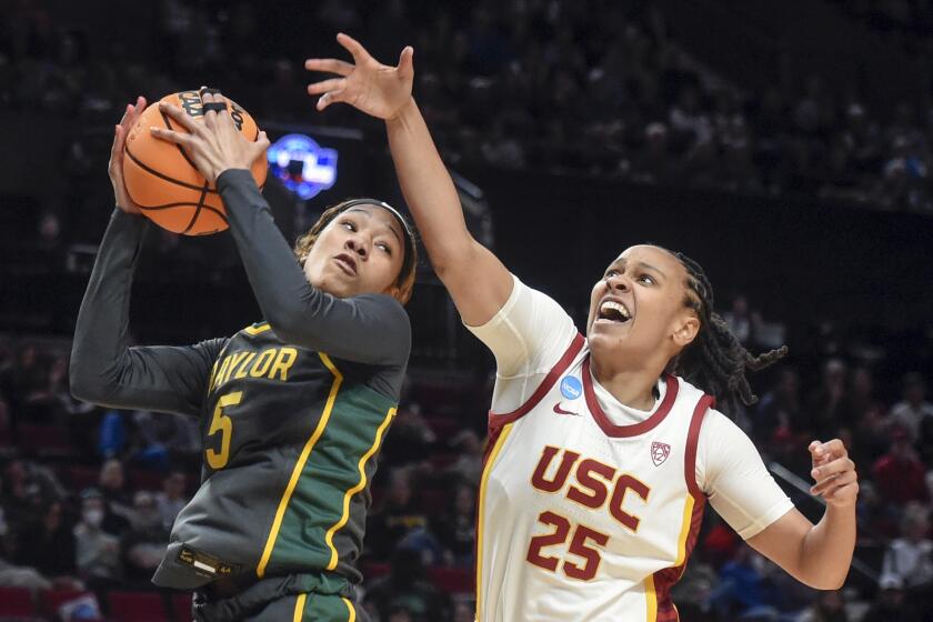 Baylor guard Darianna Littlepage-Buggs, left, grabs a rebound in front of USC guard McKenzie Forbes.