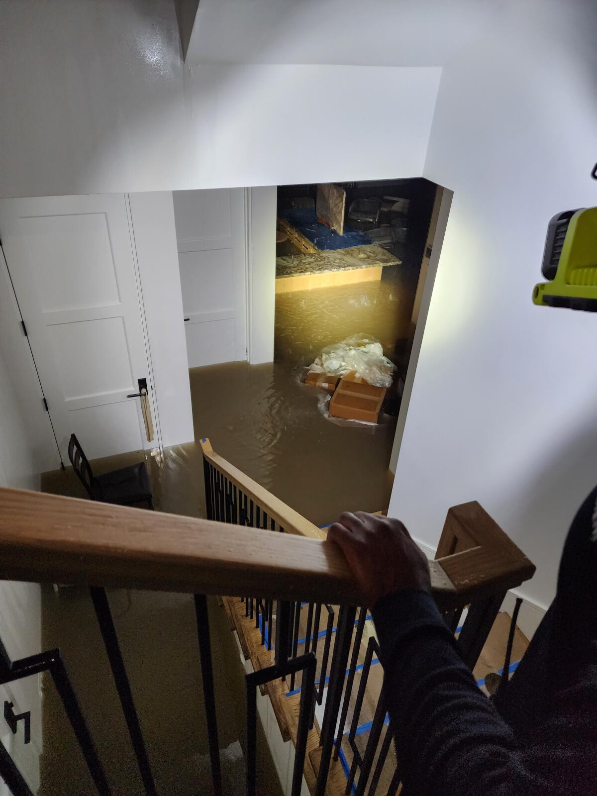 Flooding is pictured from the stairs of the Senks' home.