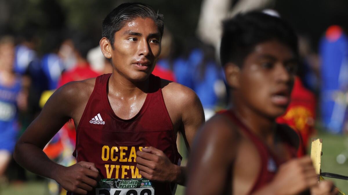 Ocean View junior Edwin Montes, left, competes in the Orange County Championships on Oct. 14, 2017.