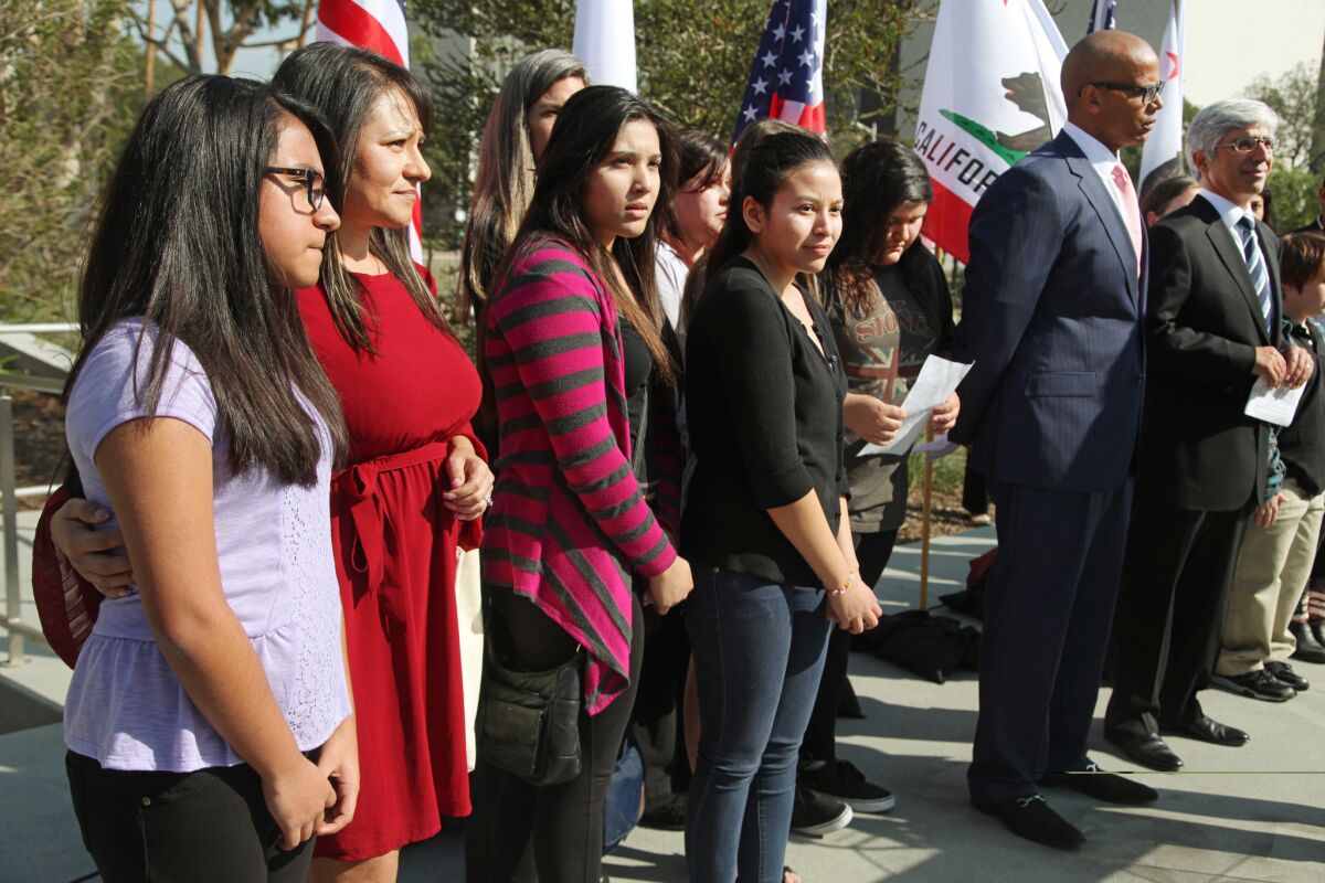Nine California public school students sued the state to abolish its laws on teacher tenure, seniority and other protections. Above, the students with their lawyers in downtown L.A. on Jan. 27, 2014.