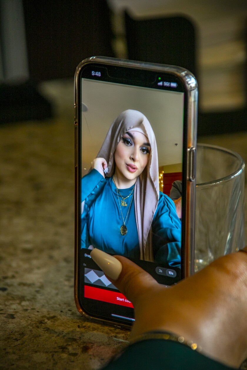 Rahan Alemi poses for a selfie as seen on her cellphone screen.