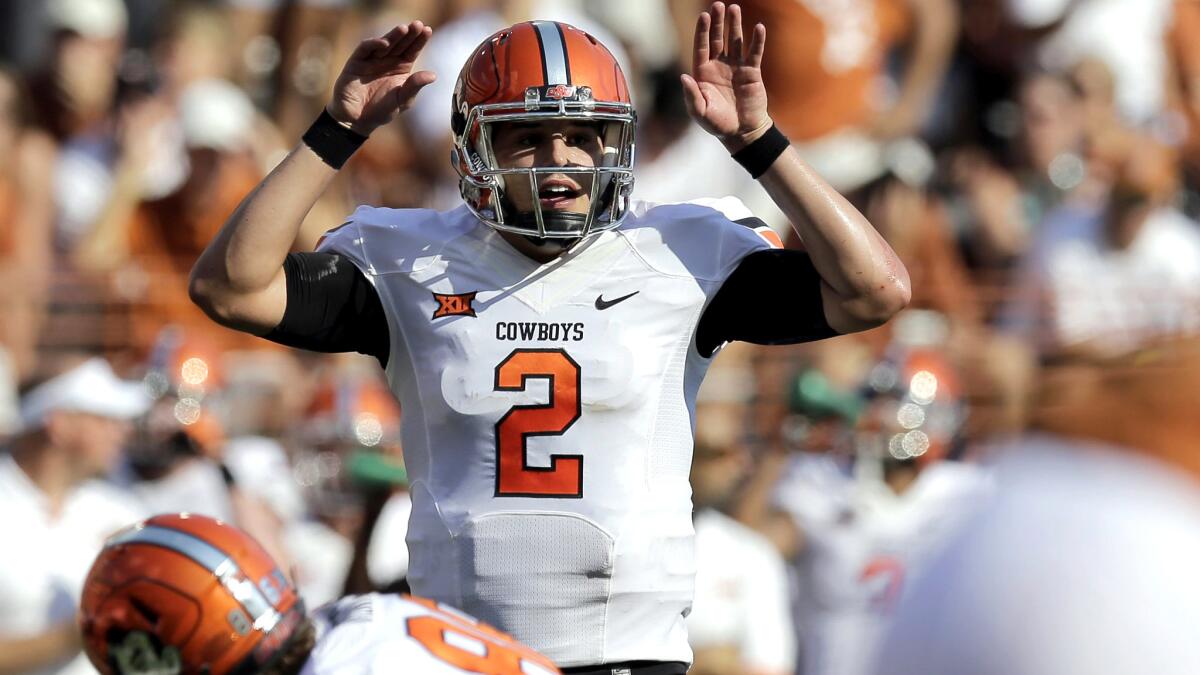 Mason Rudolph (2) has led Oklahoma State to a 10-0 record against major-college opponents with a 38-52 record. With no Big 12 Conference title game, the Cowboys could go unbeaten and get left out of the College Football Playoff.