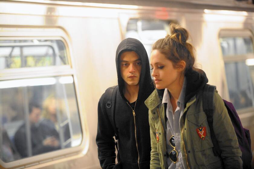 Rami Malek and Carly Chaikin on the set of "Mr. Robot."