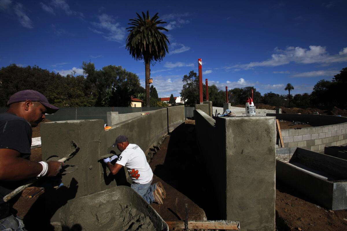 Construction workers build the Hollywood Canteen Amphitheater at the West Los Angeles campus of the U.S. Department of Veterans Affairs on Nov. 19.