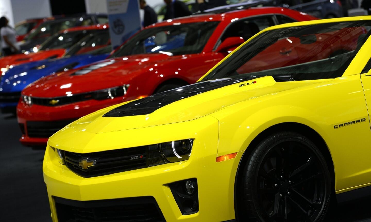 Chevrolet Camaros are displayed at the 2014 New York International Auto Show.