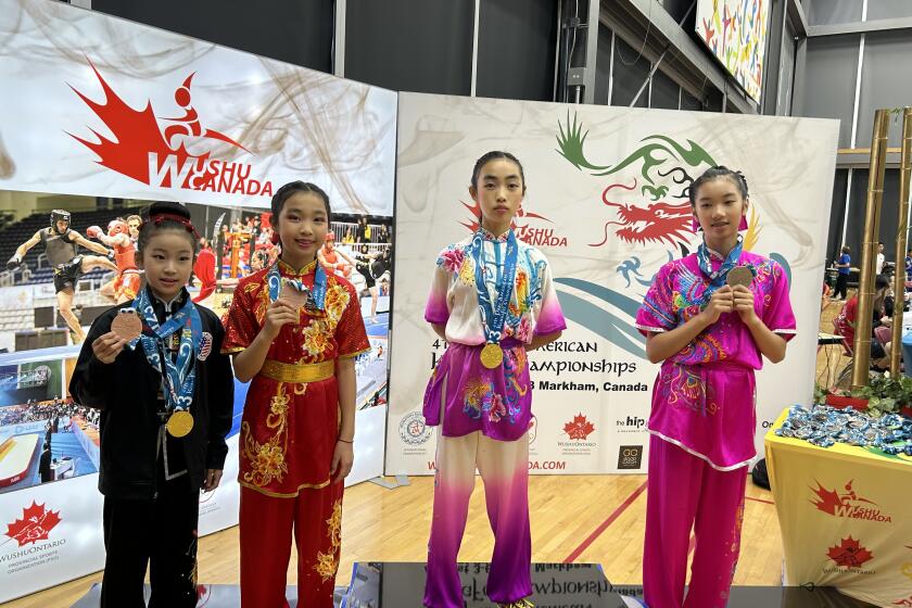 Second from left: Audrey Zhao (bronze medalist), Second from right: Kate Zhao (gold medalist) at the award ceremony.