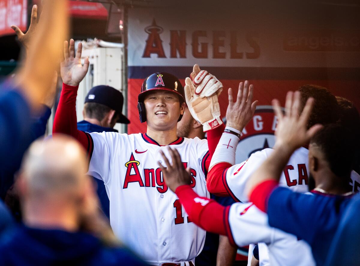 Shohei Ohtani celebrates after scoring during a game between the Angels and Pittsburgh Pirates.