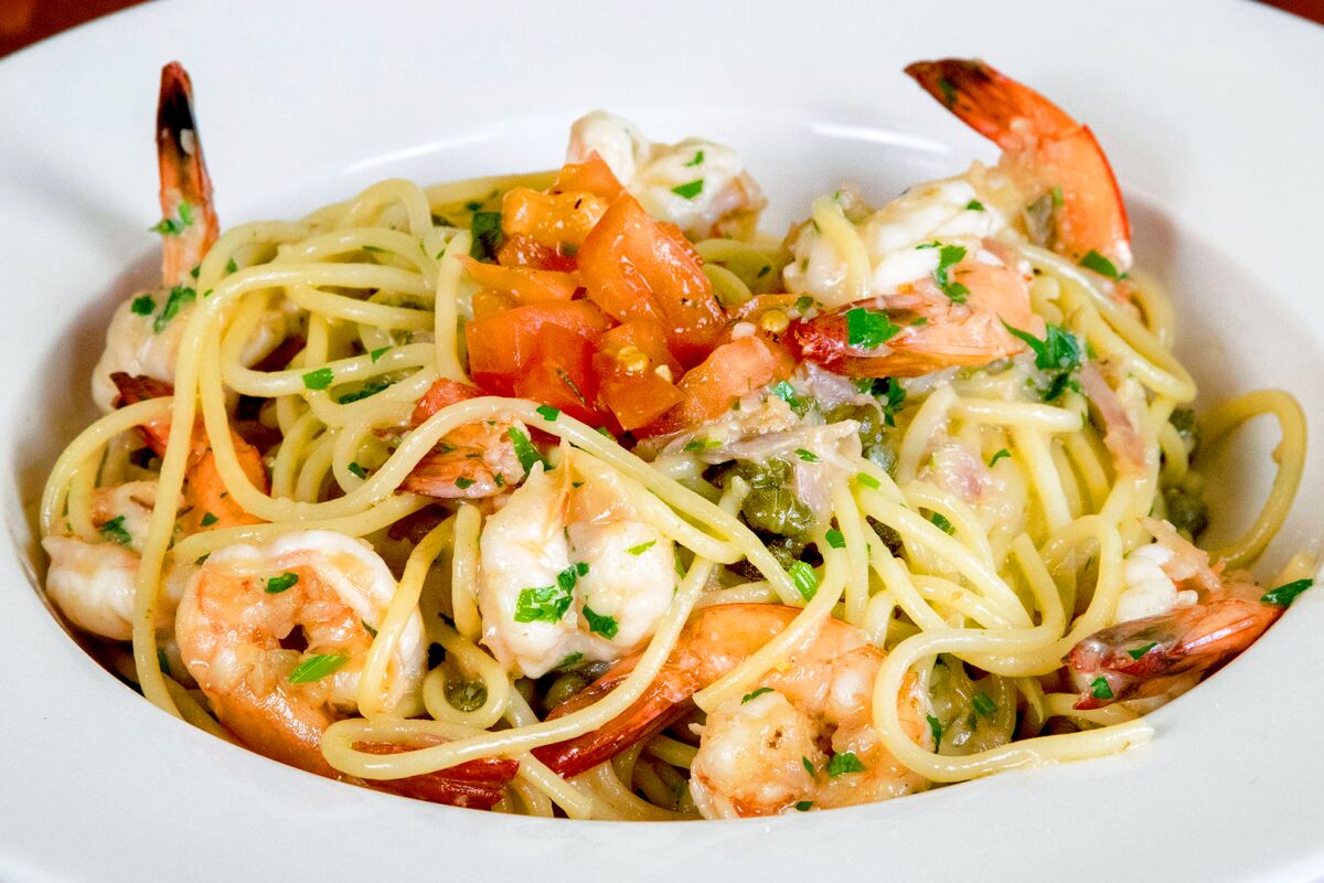 Spaghetti scampi with sautéed shrimp, garlic, shallots, capers and lemon wine butter sauce at Allegra California Café