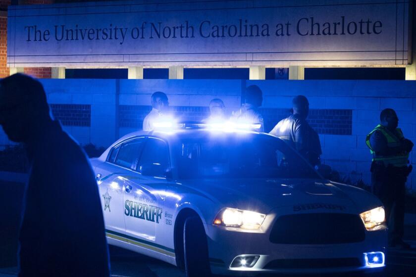 Police secure the main entrance to UNC Charlotte after a fatal shooting at the school, Tuesday, April 30, 2019, in Charlotte, N.C. (AP Photo/Jason E. Miczek)