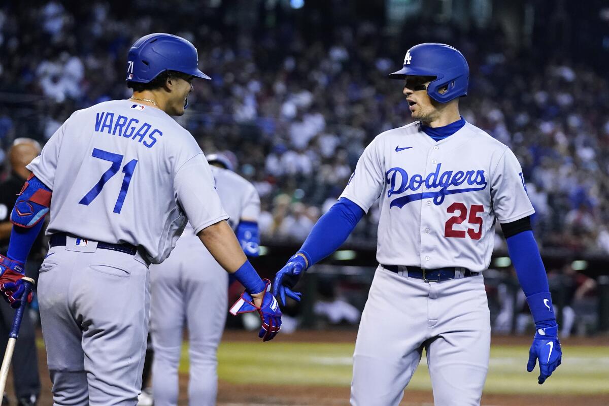 Dodgers' Trayce Thompson celebrates his home run against the Arizona Diamondbacks with Miguel Vargas.