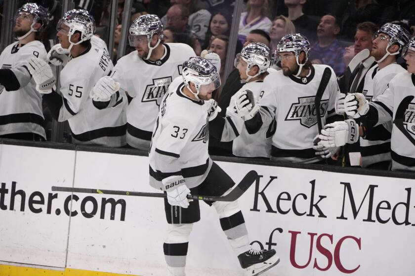 The Kings' Viktor Arvidsson (33) celebrates his first-period goal with teammates March 25, 2023.