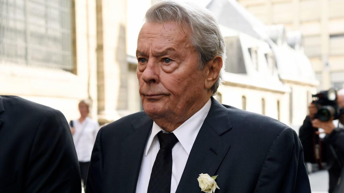 French actor Alain Delon, seen here in 2017, is the subject of protest after the Cannes Film Festival said it would award him an honorary Palme d'Or this year.
